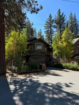 a large house with a lot of trees and a driveway at Lake Tahoe Luxury Guest Quarters in South Lake Tahoe