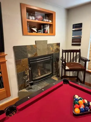 a living room with a pool table and a fireplace at Lake Tahoe Luxury Guest Quarters in South Lake Tahoe
