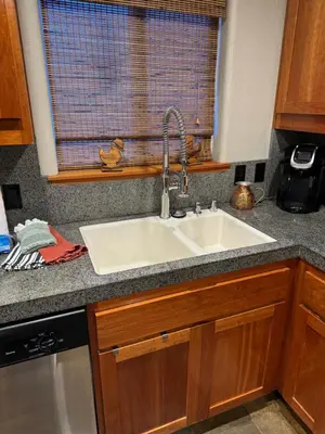 a kitchen counter with a sink and a window at Lake Tahoe Luxury Guest Quarters in South Lake Tahoe