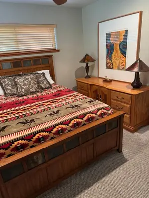 a bedroom with a bed and a dresser and a bed sidx sidx sidx sidx at Lake Tahoe Luxury Guest Quarters in South Lake Tahoe