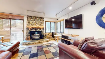 a living room with a couch and a fireplace at Wildflower #51 condo in Mammoth Lakes