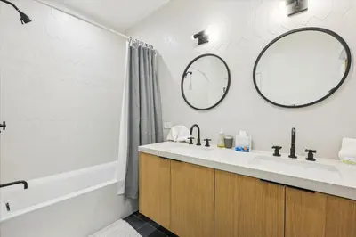 a bathroom with a sink and a mirror at Diamond Run at Palisades - Luxury Townhome, Ski Shuttle Pet Friendly and Hot Tub! in Olympic Valley