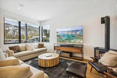 a living room with a couch and a table at Diamond Run at Palisades - Luxury Townhome, Ski Shuttle Pet Friendly and Hot Tub! in Olympic Valley