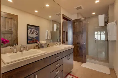 a bathroom with two sinks and a shower at Gondola Getaway- Ski-in Ski-out - Luxury 4 BR, Private Hot Tub, HOA Amenities in Truckee