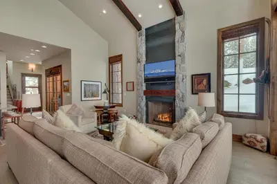 a living room with two couches and a fireplace at Gondola Getaway- Ski-in Ski-out - Luxury 4 BR, Private Hot Tub, HOA Amenities in Truckee