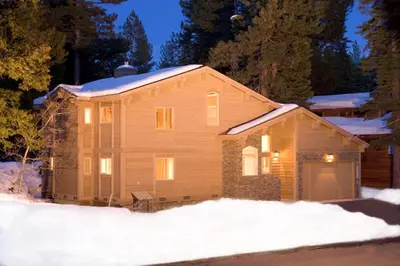 a house with snow on top of it at High Sierra at Dollar Point - Private Hot Tub, Close to Ski Resorts, Pet Friendly! in Tahoe City