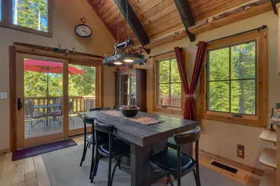 a dining room with a wooden table and chairs at Lazy Bear in Tahoe City