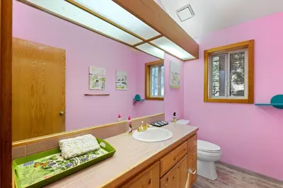 a pink bathroom with a sink and a toilet at Mosaic Magic at Northstar - Luxury 4BR with Private Hot Tub and Free Ski Shuttle in Truckee