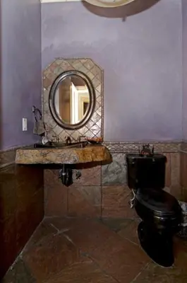 a bathroom with a mirror and a black toilet at Olive Branch - Private Hot Tub, Media Room, Pet-Friendly, Near Northstar! in Carnelian Bay