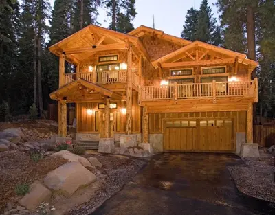 a large wooden house with a garage at Olive Branch - Private Hot Tub, Media Room, Pet-Friendly, Near Northstar! in Carnelian Bay