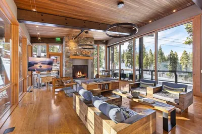 a living room filled with furniture and a fireplace at Mountainside by Tahoe Getaways - Luxury Pet-Friendly Northstar Ski-in Ski-Out - Swimming Pool and Gym! in Truckee