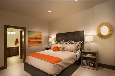 a bedroom with a large bed and a mirror at Mountainside by Tahoe Getaways - Luxury Pet-Friendly Northstar Ski-in Ski-Out - Swimming Pool and Gym! in Truckee