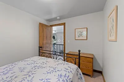 a bedroom with a bed and a wooden dresser at Ellis Peak Retreat - Hot Tub, Wood Fireplace, Close to Tahoe City & Dining in Tahoe City