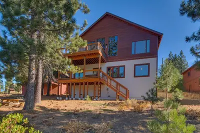 a home with a large wooden house at Pinnacle Views at Tahoe Donner - 4BR, Hot Tub in Truckee