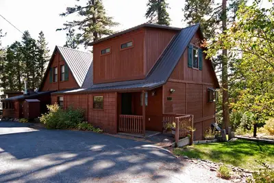 a large wooden house with a gambrel roof at Pioneer Lake View- 4BR Easy Walk to Town Private Hot Tub - Sleeps 11 in Tahoe City