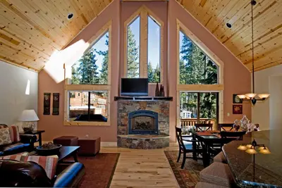 a living room with a fireplace and a tv at Red Cedar on North Shore - Beautiful 3BR w Gorgeous Furnishings in Tahoe City in Tahoe City