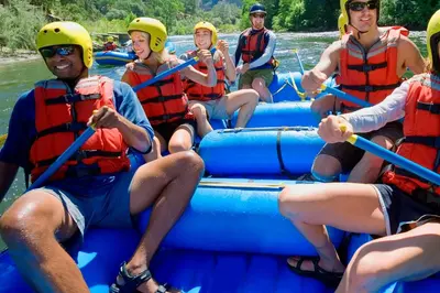 a group of people rafting down a river at Powder Run - Newly Built Palisades 3 Bedroom Townhome - Minutes to Village in Olympic Valley