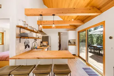 a kitchen with a wooden counter top in a room at Wildwood - Modern 2 BR with Private Hot tub Walk to North Tahoe Regional Park in Tahoe Vista