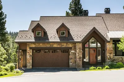 a house with a garage at Village Walk - Private Hot Tub, HOA Amenities, Pet Friendly, Walk to Lifts! in Truckee