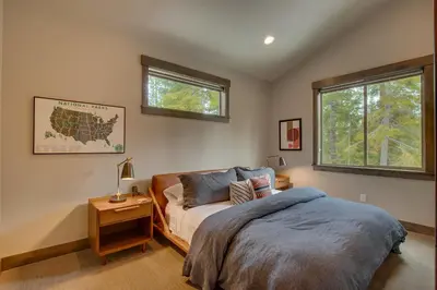 a bedroom with a bed and a window at Sunrise Abode at Tahoe Donner - Luxurious New Build, Soaking Tub, HOA Amenities in Truckee
