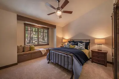 a bedroom with a bed and a ceiling fan at Lavish 4 BR in Gray's Crossing in Truckee
