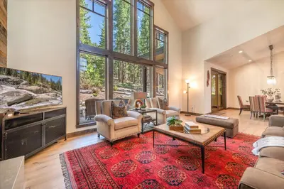 a large living room with a large window at Lavish 4 BR in Gray's Crossing in Truckee