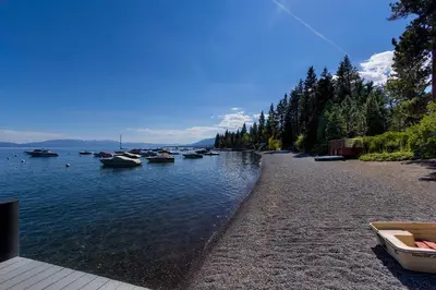a group of boats are docked on a river at Timber Grove at Tahoe Park - Gorgeous 4BR Cabin - Tahoe Park HOA, Pets OK, Near Skiing in Tahoe City