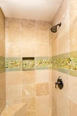 a bathroom with a shower with a shower head at Victory Place at Palisades - Stunning 5 BR with Private Hot Tub and Pool Table in Olympic Valley
