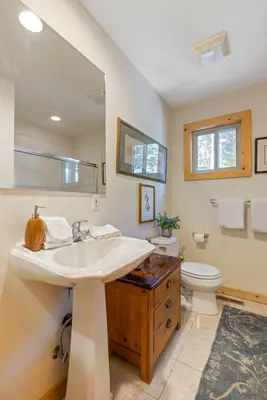 a bathroom with a sink and a toilet at Trailside - Alpine Meadows 6 Bedroom with Private Hot tub in Alpine Meadows