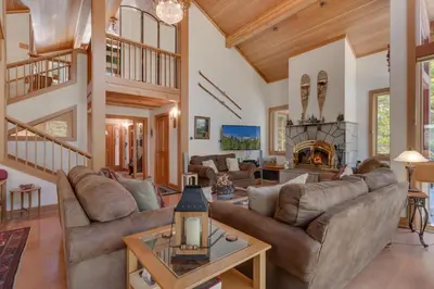 a living room with couches and a fireplace at Creek Side- 4 Primary Suites, Hot Tub, Shuttle to Slopes, Pet Friendly in Olympic Valley