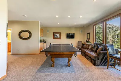 a living room with a pool table in it at Eagles Nest by Tahoe Getaways - Pet Friendly with Hot Tub, Pool Table & Shuttle to Slopes in Olympic Valley