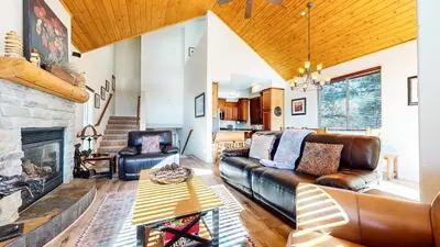 a living room with a couch and a fireplace at Mammoth Gateway Village #6 condo in Mammoth Lakes