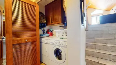 a kitchen with a washing machine and a washer at Mammoth Gateway Village #6 condo in Mammoth Lakes