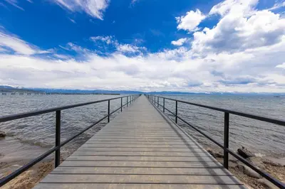 a wooden pier stretches out into the water at Starry Skies on the West Shore, Private Beach, Fireplace, Pet Friendly, Close to Ski Resorts in Tahoe City