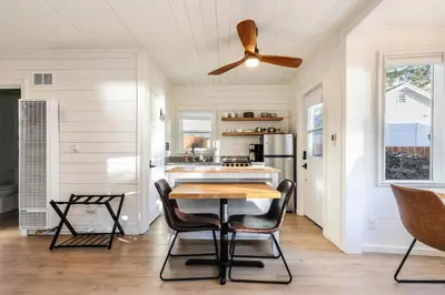 a kitchen with a ceiling fan and a table at Beach Haven Lakefront - On a Sandy Beach with Guest House in Kings Beach