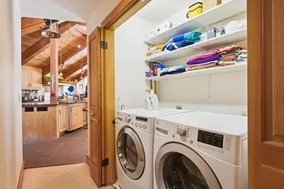 a laundry room with a washer and dryer at Alpine Adventure- Shuttle to Ski Lifts- Hot Tub- Pet Friendly in Alpine Meadows