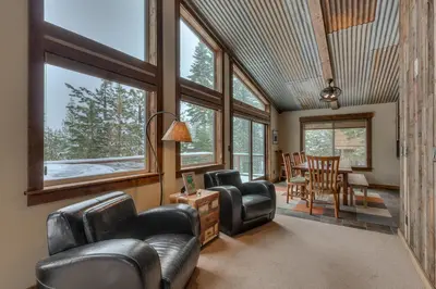 a living room with leather chairs and a table at Above the Pines - Hot Tub- Pet Friendly -Gym and Pool Access in Truckee