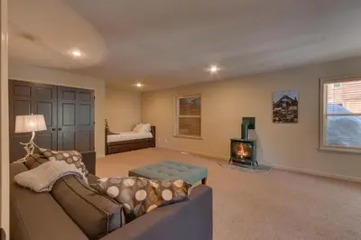 a living room with a couch and a fireplace at Above the Pines - Hot Tub- Pet Friendly -Gym and Pool Access in Truckee