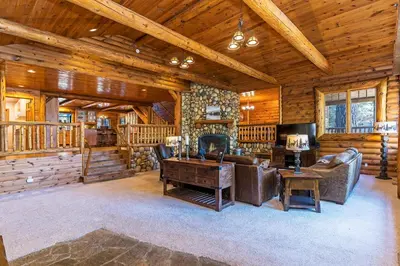 a large living room in a log cabin at 1138 Lakeshore - One-of-a-kind Lakeshore Boulevard log cabin in Incline Village