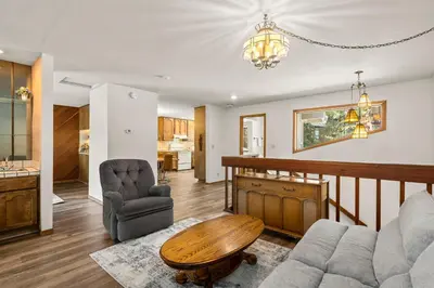 a living room with a couch and a table at 1 Sky Lake - walk to town in Incline Village