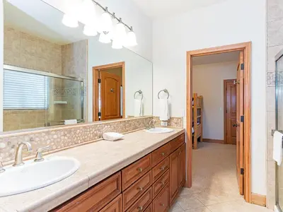 a bathroom with two sinks and a large mirror at Amazing mountain setting in Incline Village