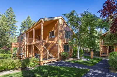 a log home with a yard at 101 McCloud - Simply Elegant in Incline Village