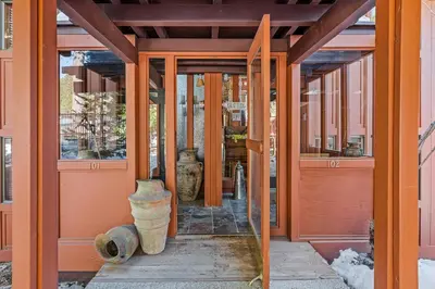 an entrance to a building with a door and a vase at Magnificent 2-bedroom, 2-bath lakefront complex in Incline Village