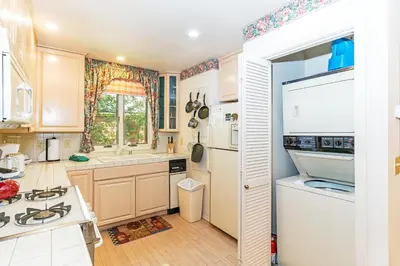 a kitchen with a white refrigerator and a sink at 107 McCloud - Highly Sought After Complex in Incline Village