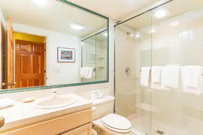 a bathroom with a toilet and a sink and a shower at 107 McCloud - Highly Sought After Complex in Incline Village