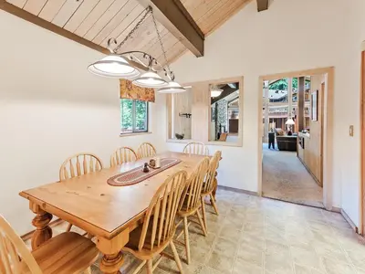 a dining room with a wooden table and chairs at Perfect location walk to town and nature in Incline Village