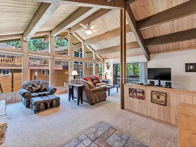 a living room with couches and a flat screen tv at Perfect location walk to town and nature in Incline Village