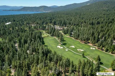 an aerial view of a golf course with trees at Perfect location walk to town and nature in Incline Village