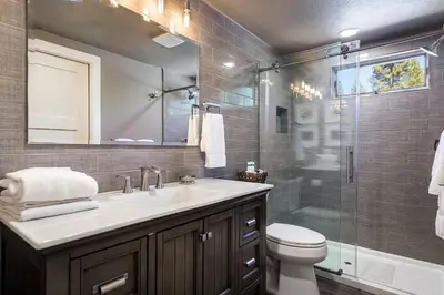 a bathroom with a toilet and a sink and a shower at 128 McCloud - Luxury Couples Retreat in Incline Village