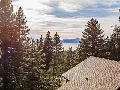 a roof of a house in the middle of trees at Fantastic Lakeview house with large decks! in Incline Village